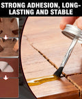 Heavy Duty Neoprene Contact Adhesive With Built In Brush applied to a cracked wooden surface for repairs.
