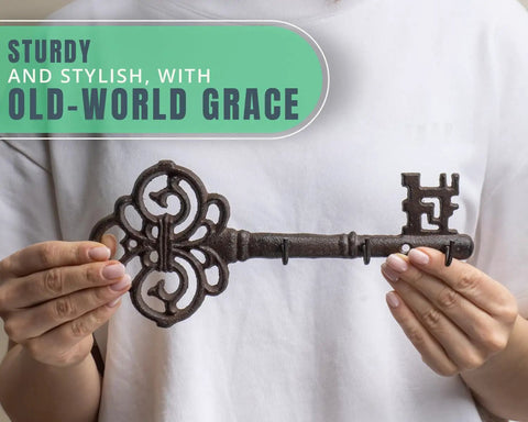 Brown Cast Iron Skeleton Key Wall Hook With Three Heavy Duty Coat Holders For Classic Farmhouse Vibes And Simple Down Home Entryway Organization Built Rock Solid For Everyday Hanging held in hands.