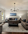 Living room with Six Light Black Modern Farmhouse Chandelier With Rustic Vintage Candle Iron Arms In Matte Black Finish