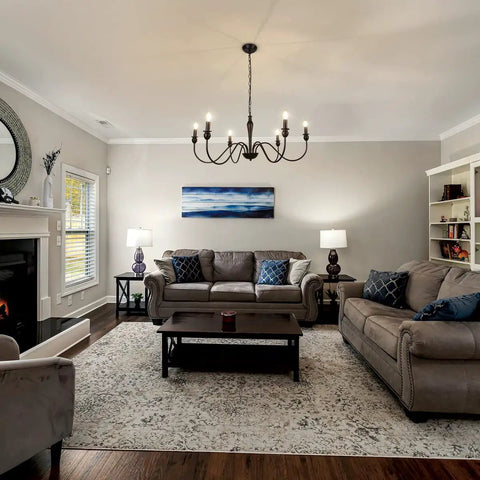 Living room with Six Light Black Modern Farmhouse Chandelier With Rustic Vintage Candle Iron Arms In Matte Black Finish