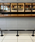 Bar Foot Rail Kit Stainless Steel Under Counter Mount Hardware With Foot Pedal, black finish underneath bar front view