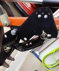 Heavy Duty Backhoe Thumb Excavator Claw For 3.25 Inch Boom Width Beefy Steel Attachment mounted on orange excavator arm