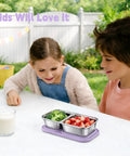 Kids enjoying lunch with Three Pack Stainless Steel Snack Containers With Silicone Lids, Dual Compartment Design, Stackable.