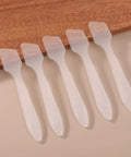 300 Pack Mini Cosmetic Spatulas 3.2 By 0.6 Inches Disposable Plastic Spatulas Clear For Facial Creams And Skin Care, No Cross Contamination, Great For Serums, Moisturizers, Face Masks, And Spa Day Vibes. Clear mini plastic cosmetic spatulas, 3.2 x 0.6 in, shown in a row