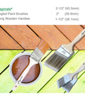 Wood Stain Brush Set With Angled Sash And Flat Brushes, 2-1/2 inch brush in wood stain can on colored boards background