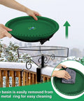 Hands holding a green basin of the Built Different 100W Heated Bird Bath For Deck Railing With Smart Thermostat for easy cleaning.