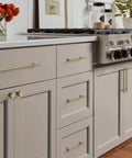 Champagne Bronze Cabinet Knobs 10 Pack Champagne Gold Cabinet Pulls for cabinets and drawers in a modern kitchen setting