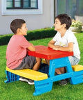 Big Plastic Picnic Table For Four Kids For Indoor And Outdoor Use Colorful Four Seat Table With 44 Pound Capacity in use outdoors