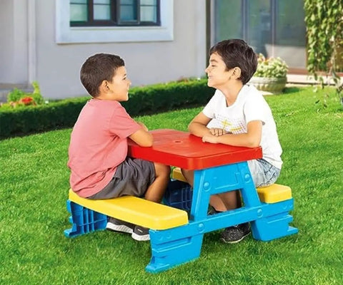 Big Plastic Picnic Table For Four Kids For Indoor And Outdoor Use Colorful Four Seat Table With 44 Pound Capacity in use outdoors