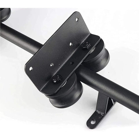Close-up of Black Sliding Barn Door Kit With Floor Roller Wheels showing black steel hardware and round tube track.