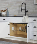 Modern kitchen with Smart Home Water Monitor with Instant Leak Detection and Real Time Alerts under sink cabinet