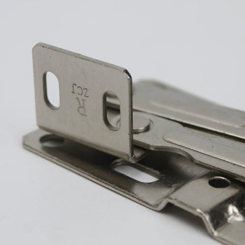 Close-up of Soft Close Tip Out Hinges For Tray Doors With Self Closing Damper 45 Degree Hidden Pivot Tilt Opening, shown flat.