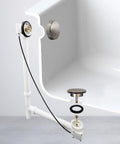 Dead Simple 27 Inch Cable Drive Bath Drain Trim Kit With Rotary Overflow Knob And Pop Up Stopper Satin Nickel finish in bathtub.