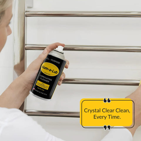 Person using Go To All Purpose Metal Lubricant And Cleaner Spray For Rust Prevention Polishing And Protection Penetrating Oil Silicone Spray Garage Door Ready Multi Purpose Metal Cleaner on metal towel rack