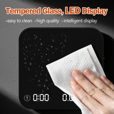 Cleaning the Palm Size Coffee Scale With Timer Auto Precision Espresso Scale 0.1g To 2000g with a cloth on glass surface