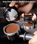 Top Shelf Espresso Accessories Kit Featuring A Dead Nuts Accurate 58mm Tamper Pro Grade Coffee Distributor, hands using tamper.