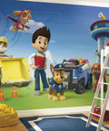 Paw Patrol Water Activated Spray And Stick Wall Mural Removable Peel And Stick 10.5 Feet By 6 Feet Easy Activation No Fuss Setup Kid Friendly Room Decor For Bedrooms And Playrooms showing characters and vehicles.