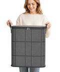 Woman holding Big Boy Sized Foldable Storage Bin With Smooth Zipper Heavy Duty Nonwoven Fabric for blankets.