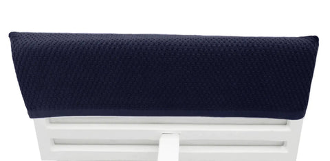 Close-up of Two Pack Navy Blue Pool Lounge Chair Covers With Waffle Weave Cotton Terry Towels on a white chair.