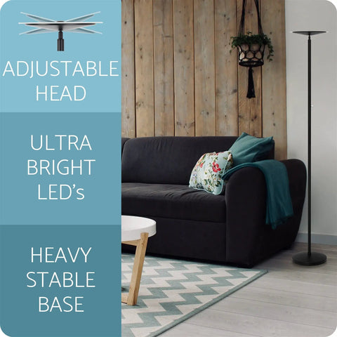70 Inch Modern LED Torchiere Floor Lamp with Glass Diffuser, Matte Black, next to black sofa in living room.
