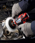 12V Cordless Mini Polisher and Drill Driver Combo Kit With Three Inch Polisher being used on car headlight by person in gloves