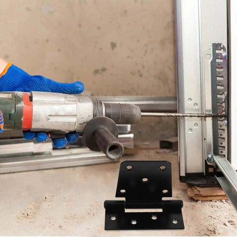 Person drilling into a frame with Heavy Duty Furniture Hinges Set In Black Carbon Steel visible in the foreground.