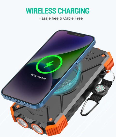 10,000mAh Solar Power Bank With Wireless Charging And 20W USB C Fast Charge, phone charging wirelessly on top, dual LED flashlight visible