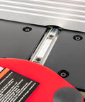 Close-up of the Six Inch Spiral Cutterhead Benchtop Jointer Loaded With Teflon Coated Aluminum Tables and safety label.
