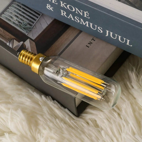 High Quality Dimmable E12 LED Bulb 6W Equal 60W Soft White 3000K Cozy Glow on fluffy surface, focus on filaments