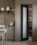 24x80 Black Frosted Glass Interior Door Slab With Dope Look And Solid Shaker Finish in kitchen pantry setting