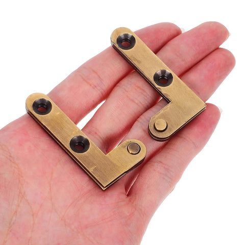 Heavy Duty Bronze Door Pivot Hinges For Concealed Interior Doors And Cabinets Down Shaft Hidden Rotation Hinges Built Tough For Smooth Quiet Operation 2 Pack held in hand