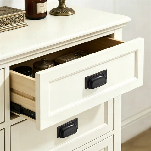 Ten Pack Oil Rubbed Bronze Cabinet Cup Pulls Two And A Half Inch 64mm for cabinets and drawers on white dresser in kitchen