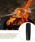 BBQ grill with revolving handle knob grip for BBQ grills and woodworking tools, chicken on skewer over flame.