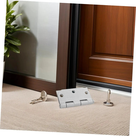 Heavy Duty Stainless Steel Door Hinges For Wood Interior Doors Featuring Built Tough Design And Zero Hassle Mounting For No Sweat Alignment And Smooth Daily Swings At Home Base displayed on a carpet with a key and lock plate.