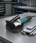 Universal 9 Inch Angle Grinder Cover With Heavy Duty Tough As Nails Debris Extraction Shroud on a workbench with metal pieces.