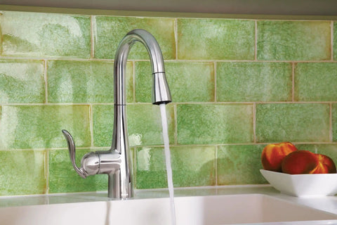High Arc Pulldown Bar Faucet With One Handle Chrome Finish, Reflex Technology, water flowing into sink, green tile backdrop