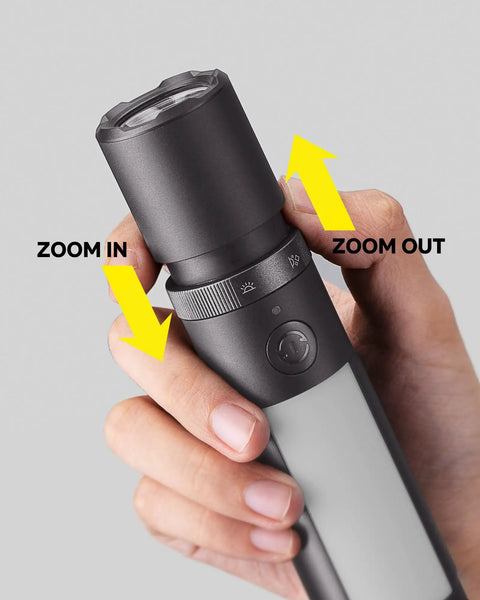 Close-up of a hand adjusting zoom on Rechargeable Magnetic LED Flashlight 1000 Lumens With Window Glass Breaker And Seat Belt Cutter