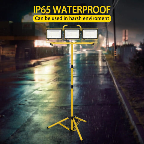 Beast 21,000 Lumen Dual Head LED Work Light With Stand in rain, showcasing waterproof feature and adjustable tripod