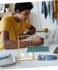 Student using Hands On Physics Experiment Tools Kit with Floating Ball on desk.