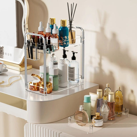 Clear 3 Tier Acrylic Rolling Storage Cart With Four Extension Poles For Tall Items And Bottles Laundry Room Bathroom Office Or Living Room Organization Mobile Multifunction Shelving Unit on a vanity holding various beauty products.