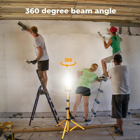 100W LED Tripod Work Light with Stand illuminating a construction site, 360 Degree Coverage, workers on ladders, clear visibility.