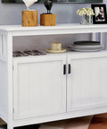White cabinet with modern finger pulls, featuring decor items on top, showcasing 2 Pack Black Aluminum Alloy Modern Finger Pulls For Cabinets And Drawers 90mm (3.5 Inch) Overall Length With 76mm Center To Center Spacing Easy Installation For Wardrobes Closets And Dressers.