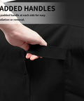 Close-up of hand holding padded handle on Heavy Duty 600D All Weather Patio Furniture Cover For Rectangular Tables And Chair Sets, Black.