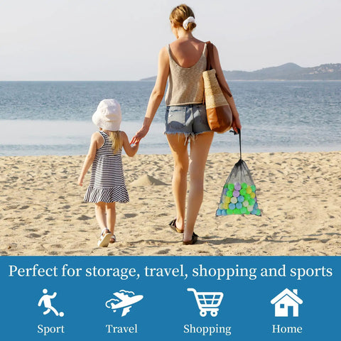 Mother and child at the beach with a Six Pack Mesh Drawstring Bag 14 By 17 Inches carrying colorful balls, ideal for multipurpose storage.