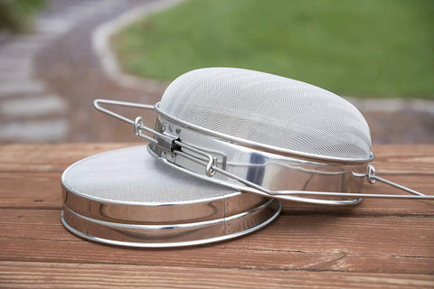 Stainless Steel Honey Strainer With Dual Sieve for Beekeeping, Fine and Coarse Mesh Filter on a wooden surface