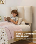 Twin Size Bed Frame Featuring Extra Thick Velvet Upholstered Headboard And Heavy Duty Hardwood Slats Pale Beige Platform Mattress Base with child reading.
