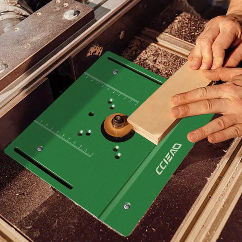 Boss Tier Router Table Lift System With Heavy Duty Aluminum Insert Plate For 65 Mm Motors, close-up on router table with wood.
