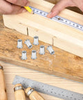 50 Pcs Stainless Steel Threaded Insert Nuts M6 Flat Head Rivnuts Kit shown with measuring tape on wood surface for projects