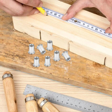 50 Pcs Stainless Steel Threaded Insert Nuts M6 Flat Head Rivnuts Kit shown with measuring tape on wood surface for projects