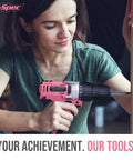 Person using pink cordless drill set 18V with 18Nm torque, 550 RPM, bit set for wood, steel, concrete, home repairs and DIY